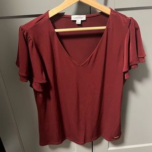 Calvin Klein blouse. Wine color stretchy material. Very cute!